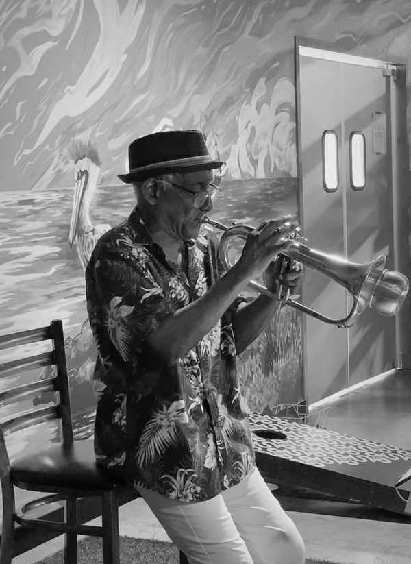 A multi talented solo artist performing his trumpet solo at an event | Altus Entertainment